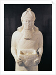 Statuette of a man carrying a box by Assyrian
