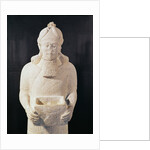 Statuette of a man carrying a box by Assyrian