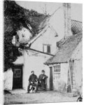 Two men outside Enfield cottage, c.1890 by English Photographer