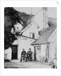 Two men outside Enfield cottage, c.1890 by English Photographer