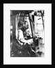 Man working at a handloom by English Photographer