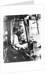 Man working at a handloom by English Photographer