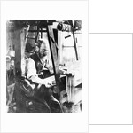 Man working at a handloom by English Photographer