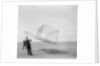 Wilbur Wright at left and Orville Wright at right, with a glider flying as a kite near the ground, 1901 by Anonymous