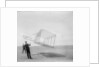 Wilbur Wright at left and Orville Wright at right, with a glider flying as a kite near the ground, 1901 by Anonymous