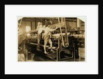 Small boys climbing on spinning frame to mend broken threads and replace empty bobbins at Bibb Mill, Macon, Georgia, 1909 by Lewis Wickes Hine
