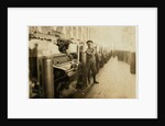Boy sweeper by carding machines at Lincoln Cotton Mills, Evansville, Indiana in stockinged feet on a slippery floor, 1908 by Lewis Wickes Hine