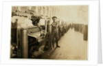 Boy sweeper by carding machines at Lincoln Cotton Mills, Evansville, Indiana in stockinged feet on a slippery floor, 1908 by Lewis Wickes Hine