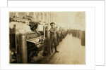 Boy sweeper by carding machines at Lincoln Cotton Mills, Evansville, Indiana in stockinged feet on a slippery floor, 1908 by Lewis Wickes Hine