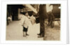 6 year old newsboy Hyman selling papers until 6 p.m. in Lawrence, Massachusetts, 1911 by Lewis Wickes Hine