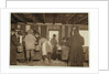 10 year old Mike Murphy, 7 year old Annie Healy and 10 year old Ross Healy in the shucking shed at Alabama Canning Co, Bayou La Batre, Alabama, 1911 by Lewis Wickes Hine