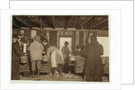 10 year old Mike Murphy, 7 year old Annie Healy and 10 year old Ross Healy in the shucking shed at Alabama Canning Co, Bayou La Batre, Alabama, 1911 by Lewis Wickes Hine