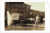 Men in front of a Wells Fargo & Co Express depot with crates and milk cans, Springfiled, Missouri, 1916 by Lewis Wickes Hine