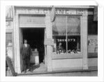 E.J. Crane, watchmaker and jewelry store, c.1899 by American Photographer