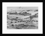 D Day: view of landing craft, barrage balloons, and allied troops landing in Normandy, 1944 by American Photographer