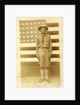 World War I soldier with American flag in background, 1914-18 by American Photographer