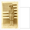 World War I soldier with American flag in background, 1914-18 by American Photographer