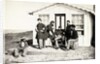 Five Civil War soldiers gathered on dirt porch outside home, African American youth seated near them, 1861-65 by American Photographer