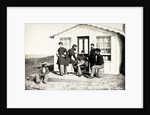 Five Civil War soldiers gathered on dirt porch outside home, African American youth seated near them, 1861-65 by American Photographer