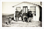 Five Civil War soldiers gathered on dirt porch outside home, African American youth seated near them, 1861-65 by American Photographer