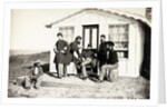 Five Civil War soldiers gathered on dirt porch outside home, African American youth seated near them, 1861-65 by American Photographer