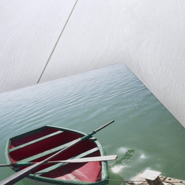 Rowing boat moored at the end of a jetty by Anonymous