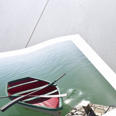 Rowing boat moored at the end of a jetty by Anonymous