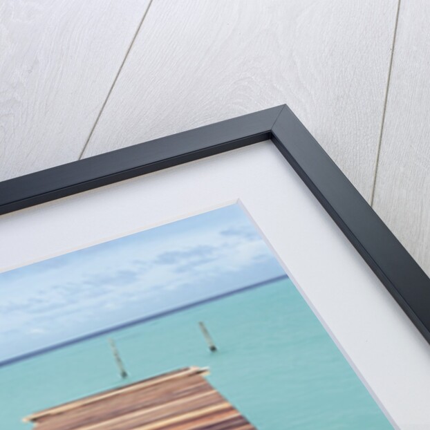 Wooden jetty leading out to sea by Anonymous