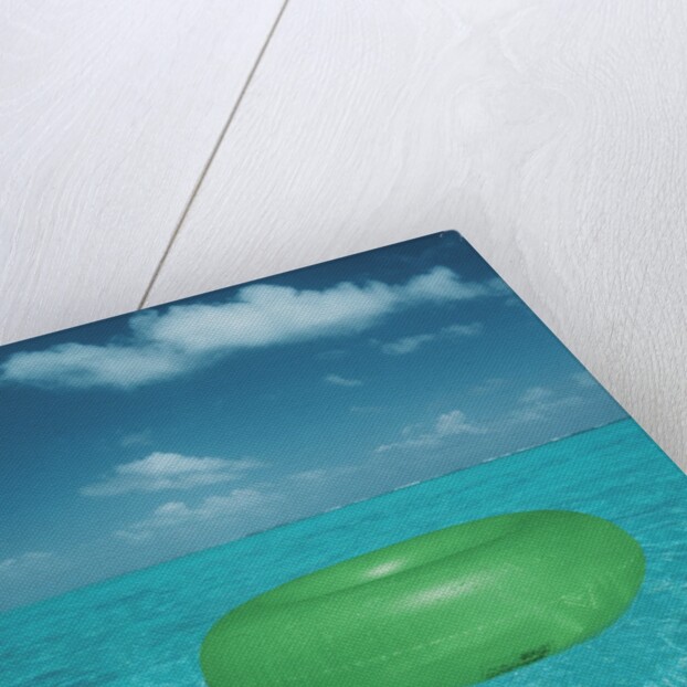 Inflatable rubber ring floating in the sea by Anonymous