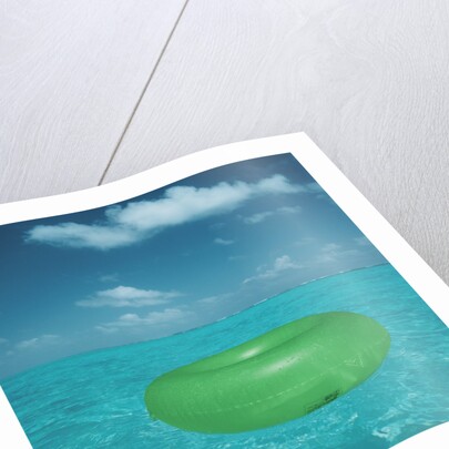 Inflatable rubber ring floating in the sea by Anonymous