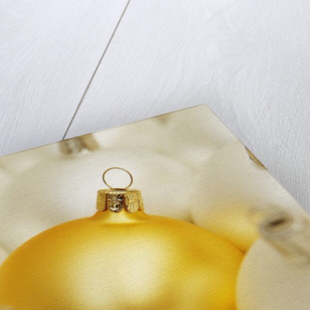 White Christmas tree decorations and a yellow one by Anonymous