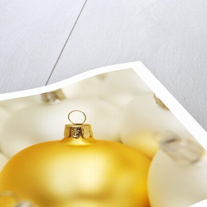 White Christmas tree decorations and a yellow one by Anonymous