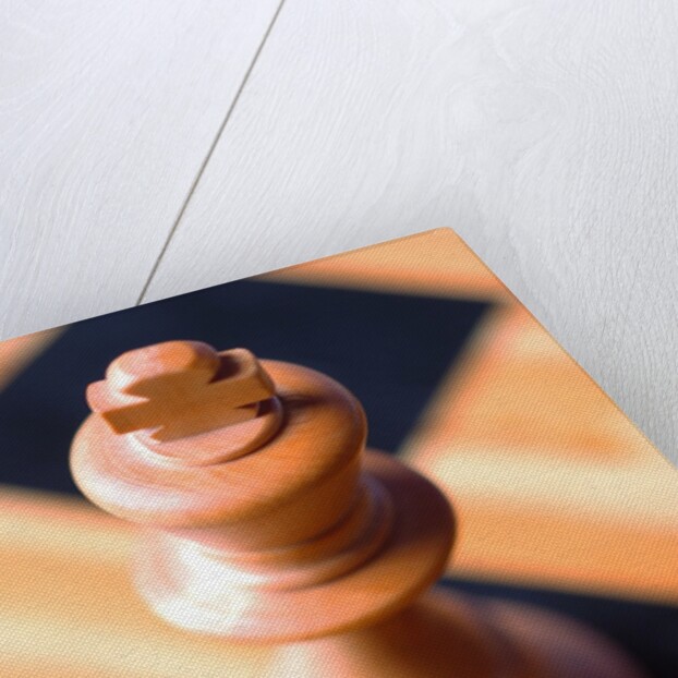 King chess piece on chessboard by Anonymous