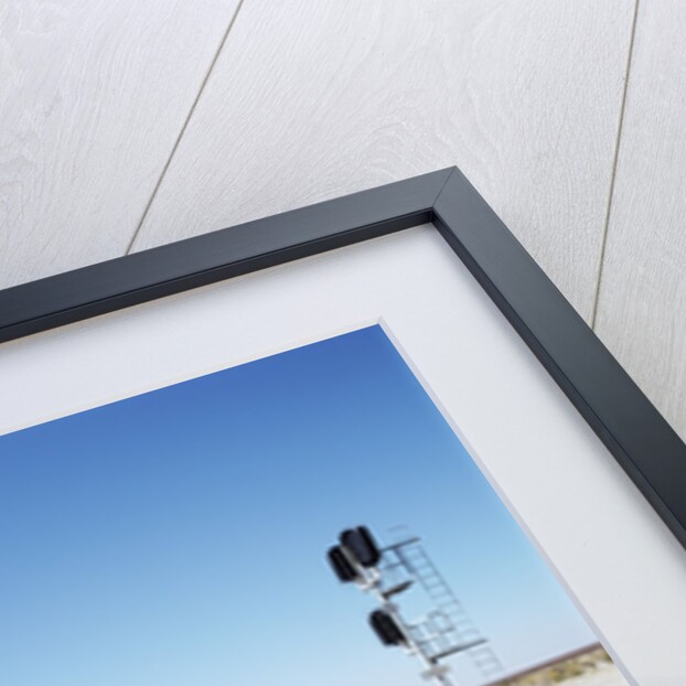 Railroad tracks running through desert setting by Anonymous