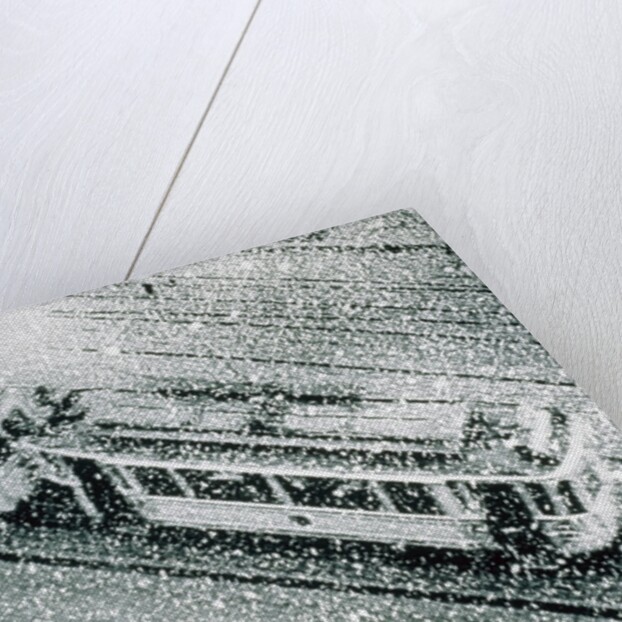 Urban traffic during snowfall, historic photo by Anonymous