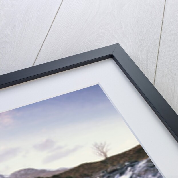 View of a river running over rocks by Anonymous