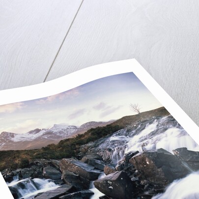 View of a river running over rocks by Anonymous