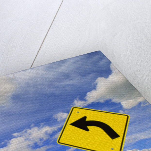 Curve Road Sign on Highway Against Sky by Anonymous