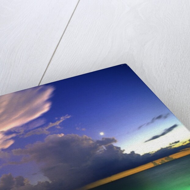 Lighting striking over green and blue water by Anonymous