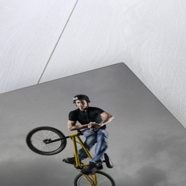 BMX Biker Performing Tricks by Anonymous