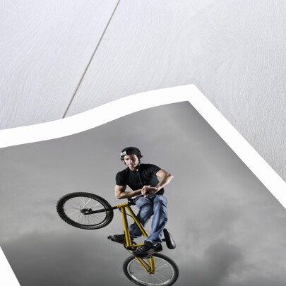 BMX Biker Performing Tricks by Anonymous