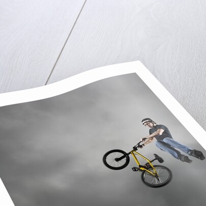 BMX Biker Performing Tricks by Anonymous