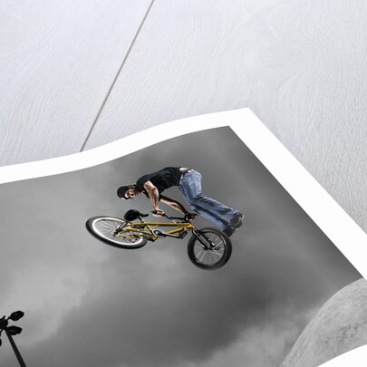 BMX Biker Performing Tricks by Anonymous