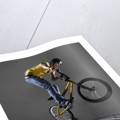 BMX Biker Performing Tricks by Anonymous
