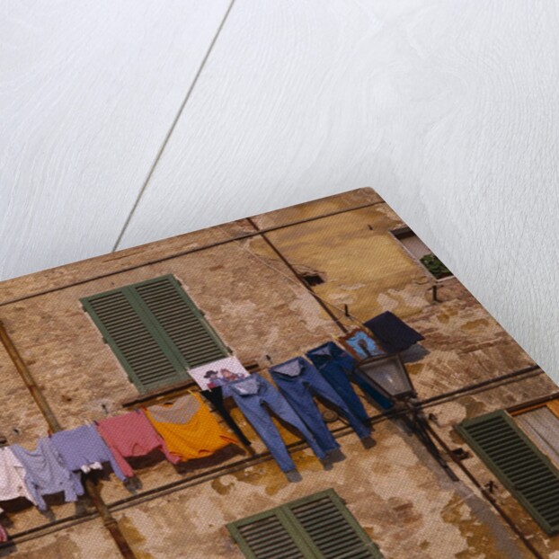 Laundry Hanging Outside Windows by Anonymous