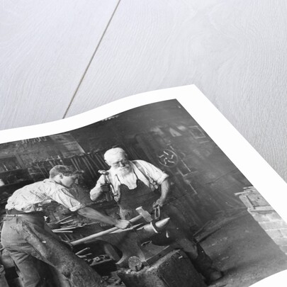 Blacksmiths at Work by Anonymous