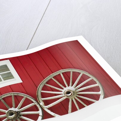 Wagon Wheels on Snow Against Stable by Anonymous