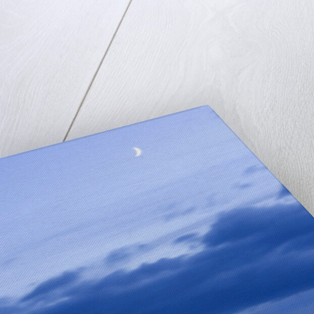 New Moon and Cumulus Clouds Above Sea at Winter Dawn by Anonymous