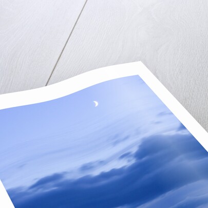 New Moon and Cumulus Clouds Above Sea at Winter Dawn by Anonymous