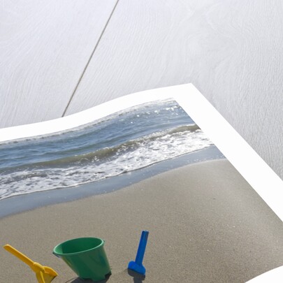 Toy Shovels in Sand by Anonymous